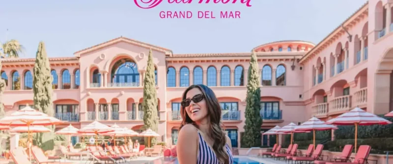 Woman smiling by the pool at Fairmont Grand Del Mar, NYC web designer and video editor.